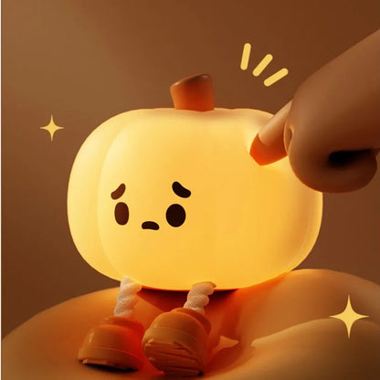 "Soft silicone Halloween pumpkin night light, perfect for kids' room decor, dimmable and rechargeable."