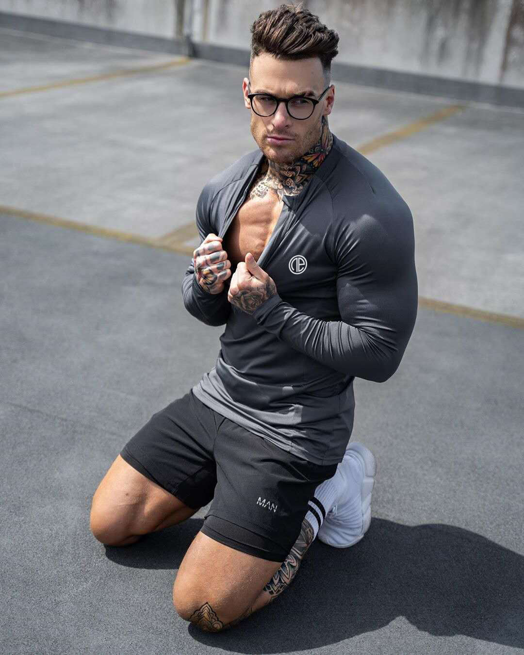 Men's black long sleeve zipper neck fitness shirt for gym workouts