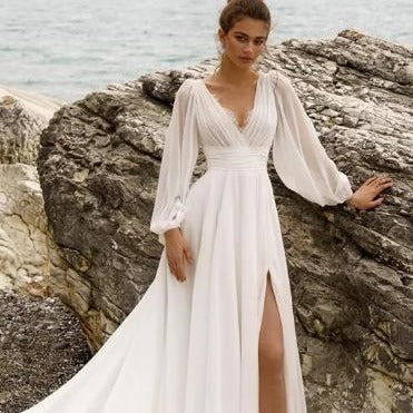 High Waist Plus Size Wedding Dress with Deep V-Neck, Long Sleeves, Backless Design, and High Slit for a sophisticated bridal look.