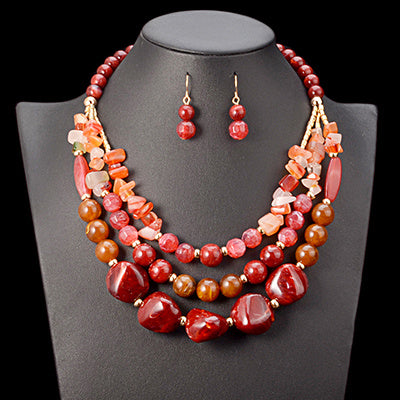 Handmade African beads jewelry set for weddings, including a traditional necklace and matching earrings, perfect for bridal accessories and cultural ceremonies."