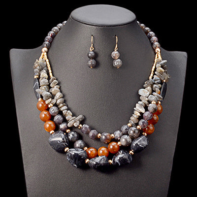 Handmade African beads jewelry set for weddings, including a traditional necklace and matching earrings, perfect for bridal accessories and cultural ceremonies."