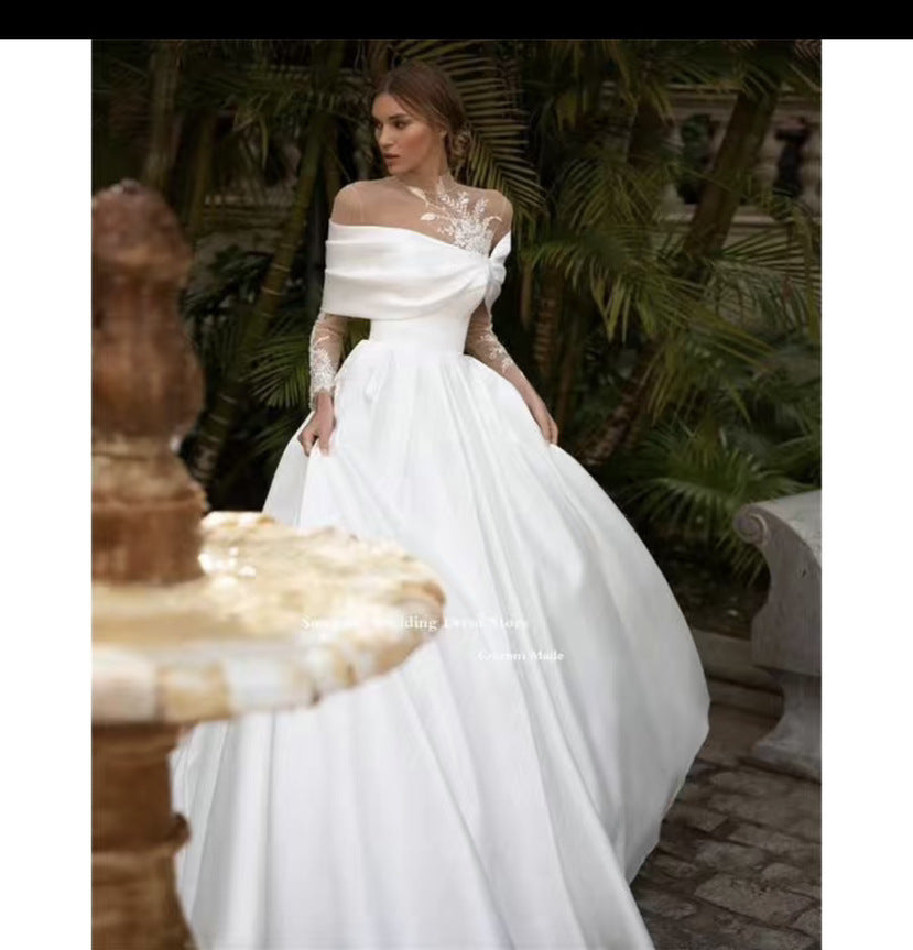 Raglan Sleeve Long Sleeve White Wedding Dress in satin with a tutu skirt, offering an elegant and classic bridal look.