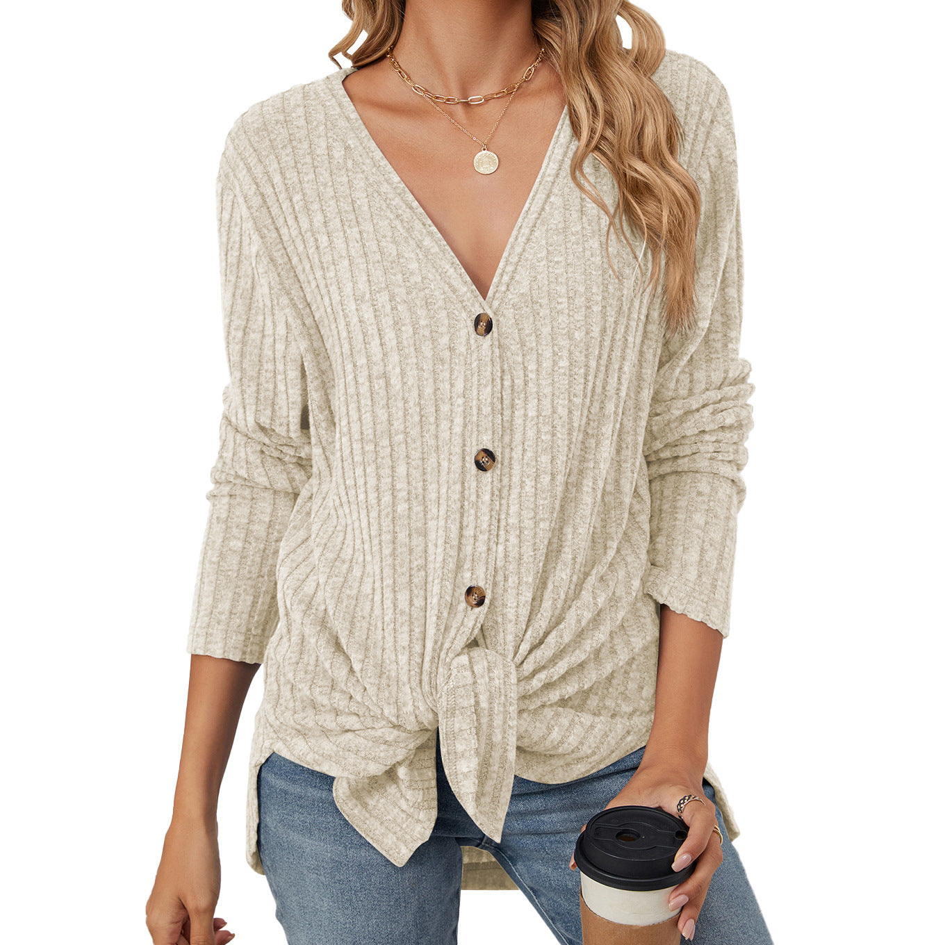 Women's solid color knitted cardigan with long sleeves and button closure. Emerized coat for a cozy and stylish look."