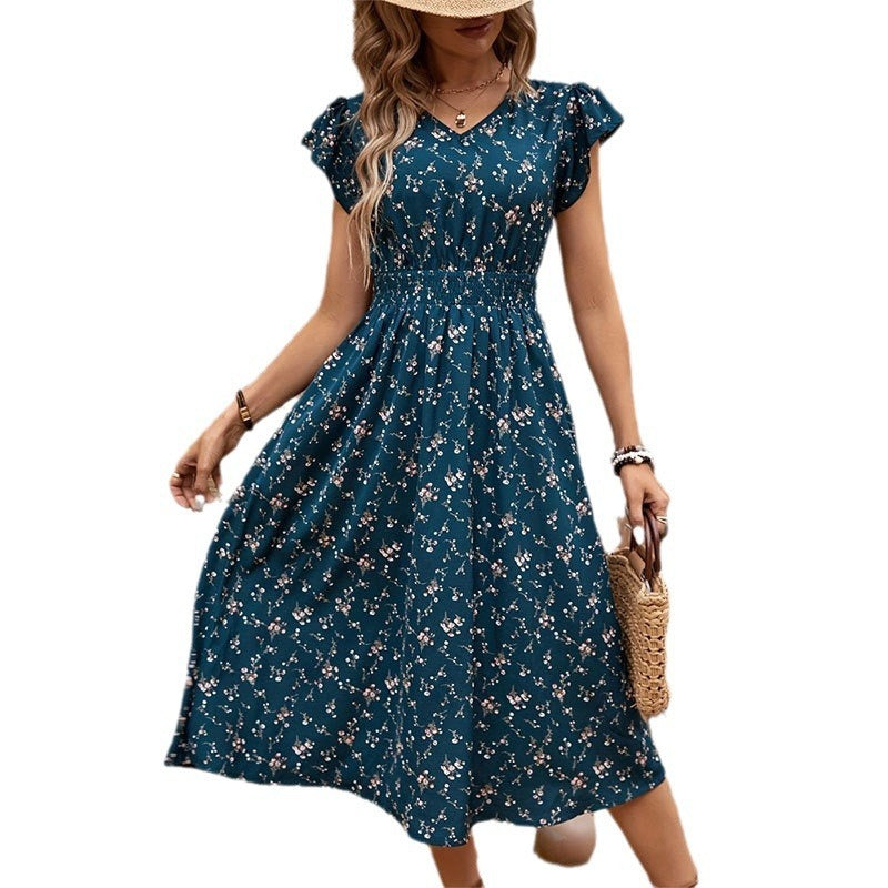 "Elegant floral dress for women in chic temperament style, perfect for summer occasions, featuring a flowy design with vibrant floral patterns."