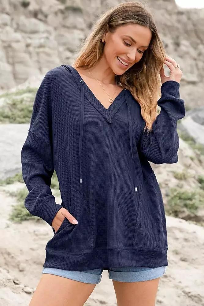 "Women's V-neck Waffle Hoodie in Solid Color - Long-sleeved, stylish, and comfortable sweatshirt ideal for layering and casual wear."