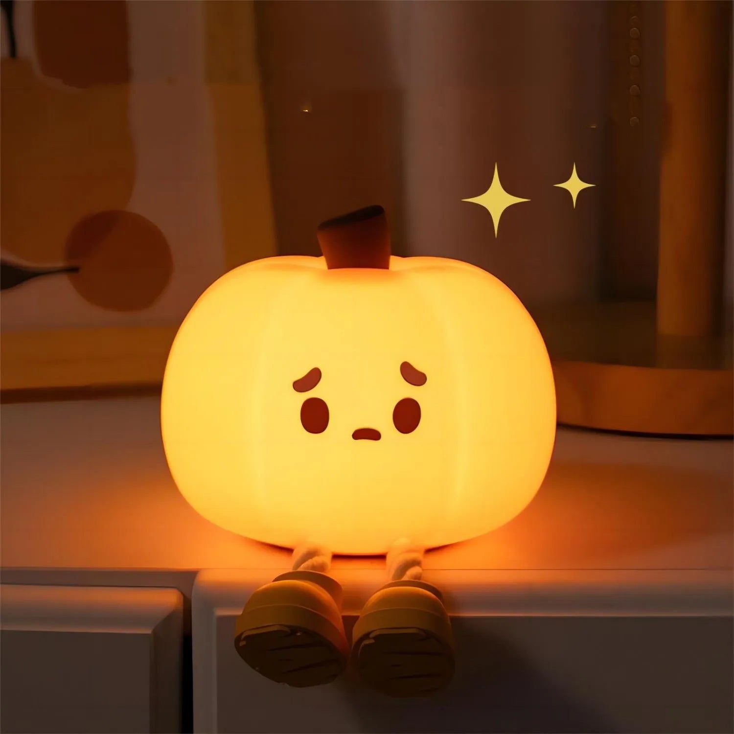 "Soft silicone Halloween pumpkin night light, perfect for kids' room decor, dimmable and rechargeable."