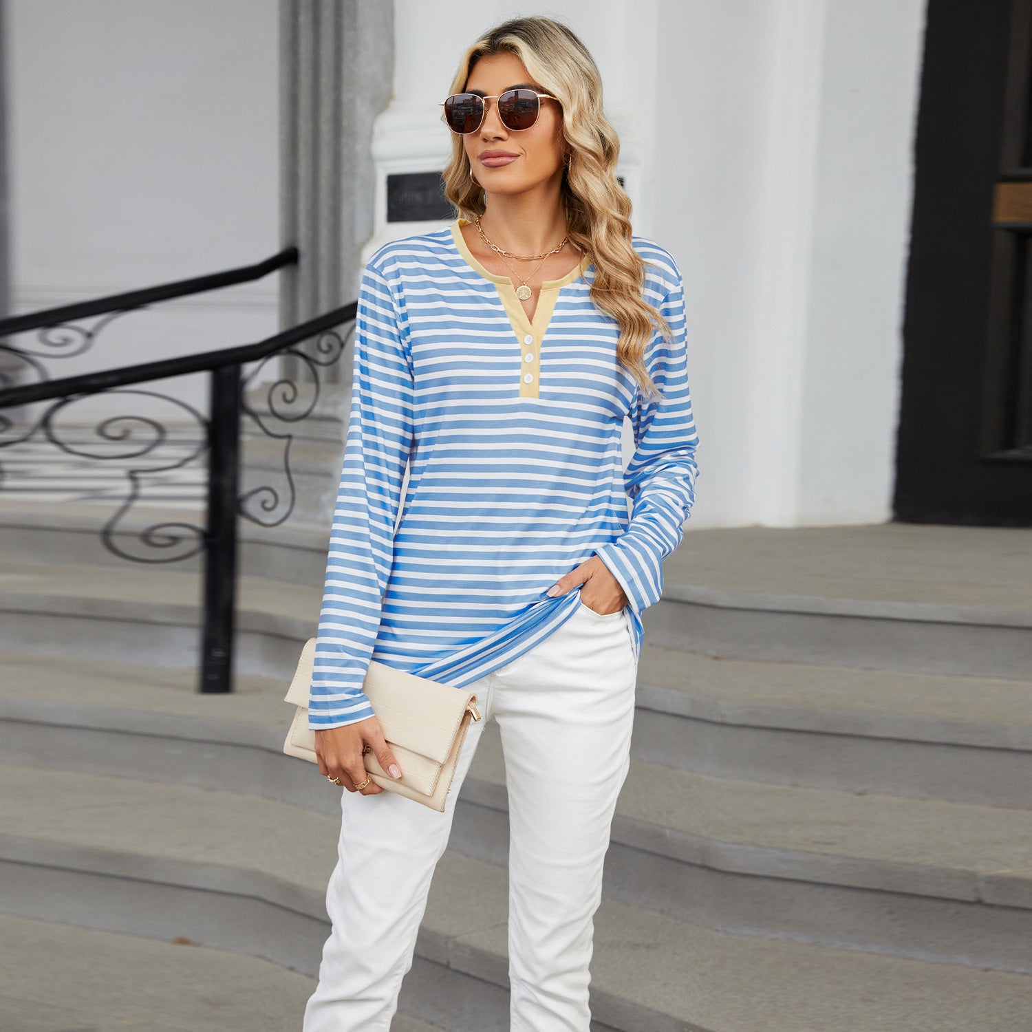 Women's V-neck striped long-sleeve T-shirt with a loose fit. Casual and comfortable top for everyday wear."