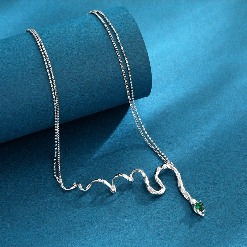 Women's Magic Snake Necklace with green zircon stone, serpent design pendant.