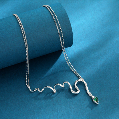 Women's Magic Snake Necklace with green zircon stone, serpent design pendant.