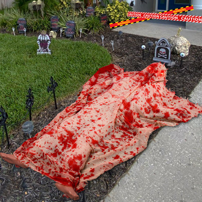 Voice-activated Halloween corpse prop with glowing hair and blood cloth for spooky decoration