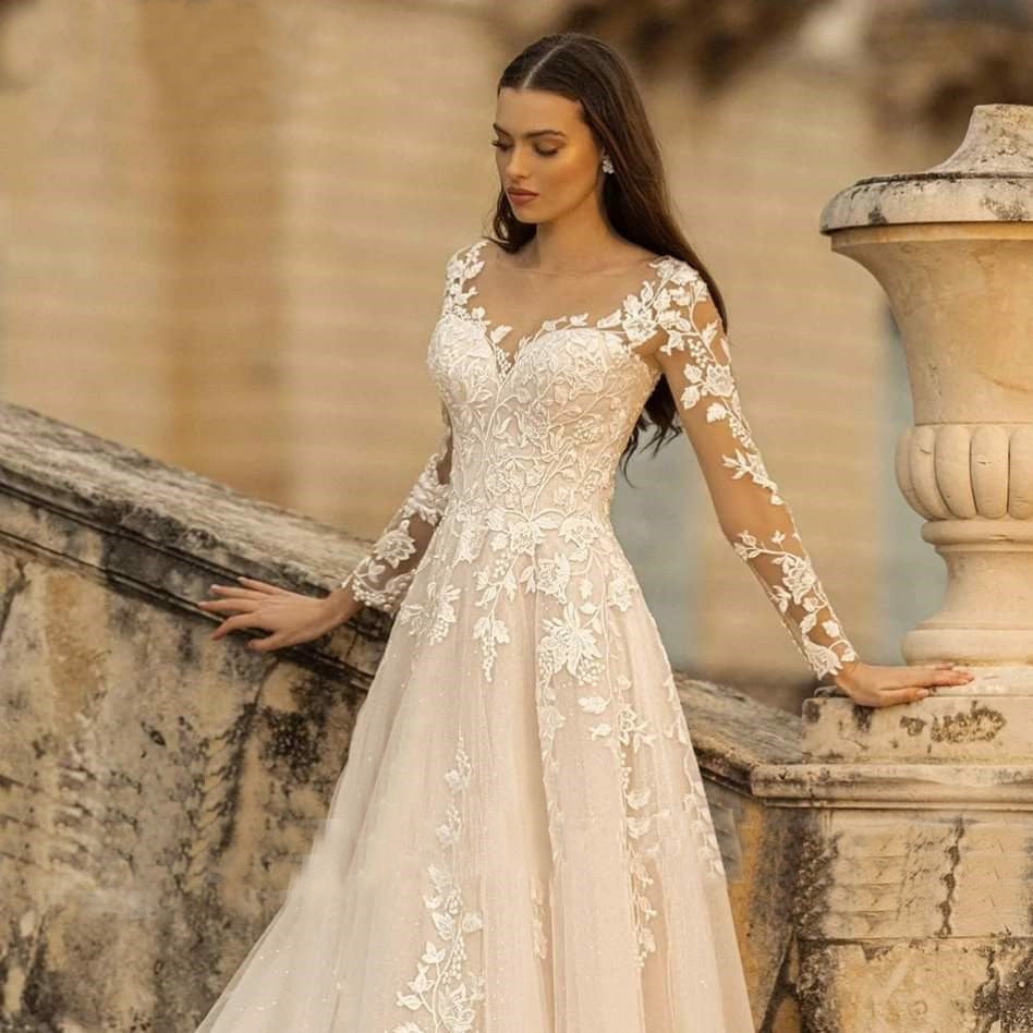  "Long-Sleeve Mori Style Wedding Dress with a simple round neck, offering an elegant and timeless bridal look."