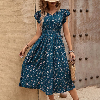 "Elegant floral dress for women in chic temperament style, perfect for summer occasions, featuring a flowy design with vibrant floral patterns."