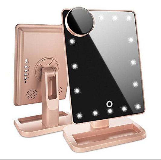 Touch screen makeup mirror with 20 LED lights, 10X magnifying mirror, and built-in Bluetooth music speaker. Illuminated vanity mirror for flawless makeup application.