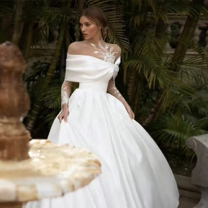 Raglan Sleeve Long Sleeve White Wedding Dress in satin with a tutu skirt, offering an elegant and classic bridal look.