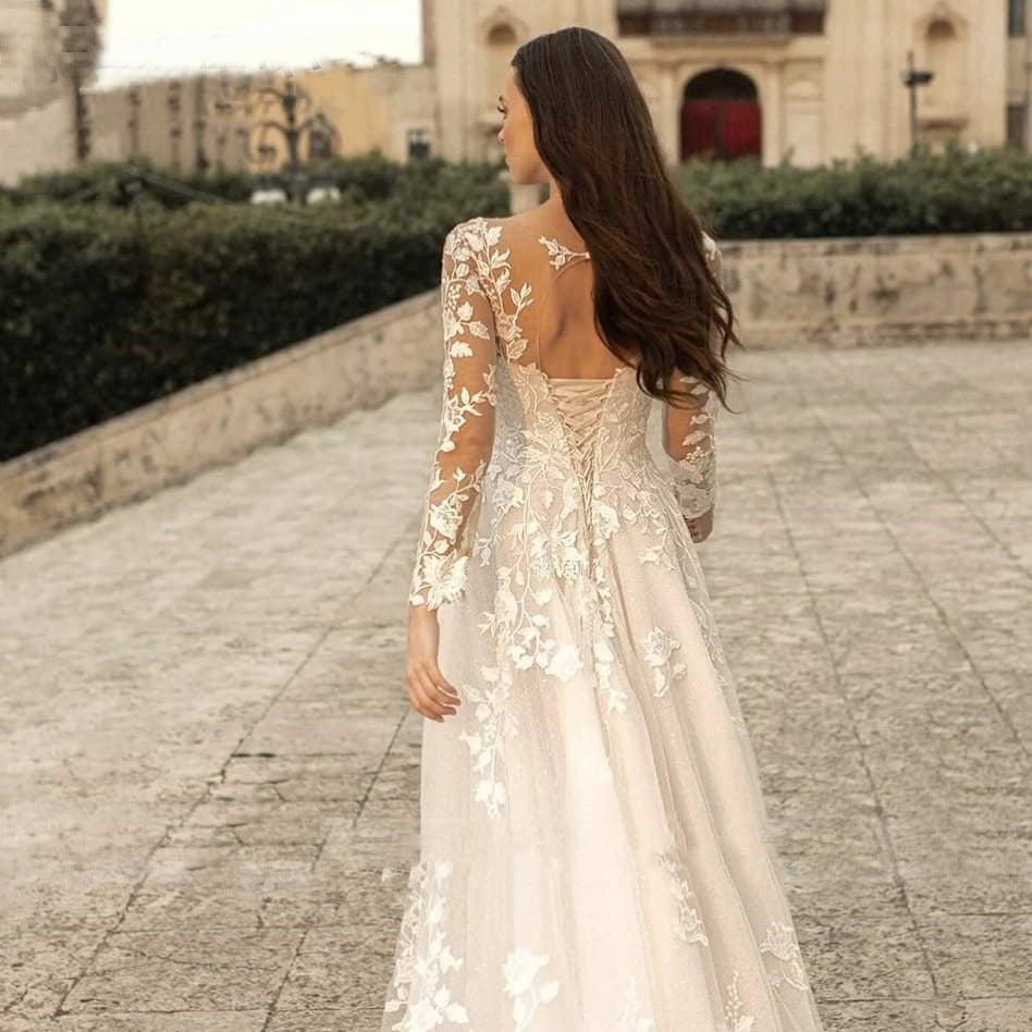  "Long-Sleeve Mori Style Wedding Dress with a simple round neck, offering an elegant and timeless bridal look."