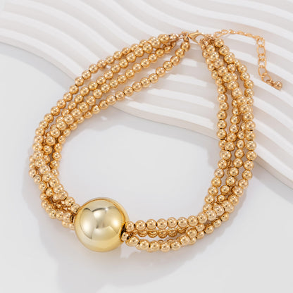 European American multi-layer necklace featuring a bold ball pendant