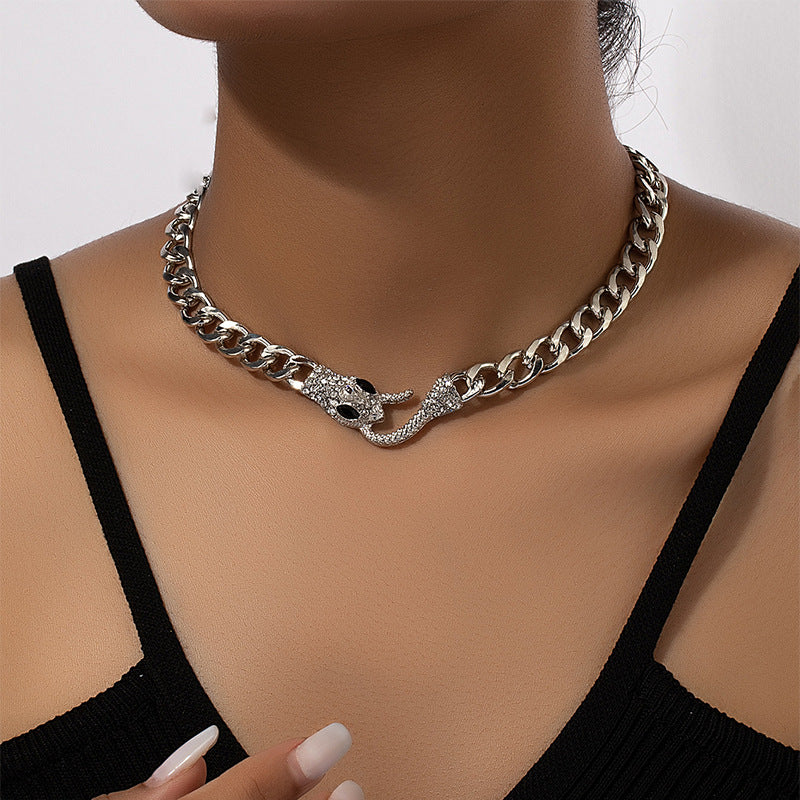 European American metal chain necklace featuring a snake-shaped pendant