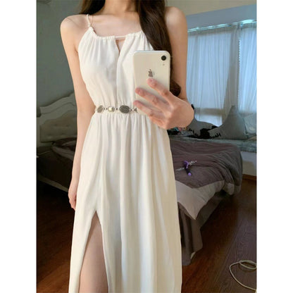 sleeveless halter dress featuring a seaside vacation style with a fitted waist-tight skirt. Ideal summer outfit for a relaxed and stylish look."






