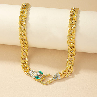 European American metal chain necklace featuring a snake-shaped pendant