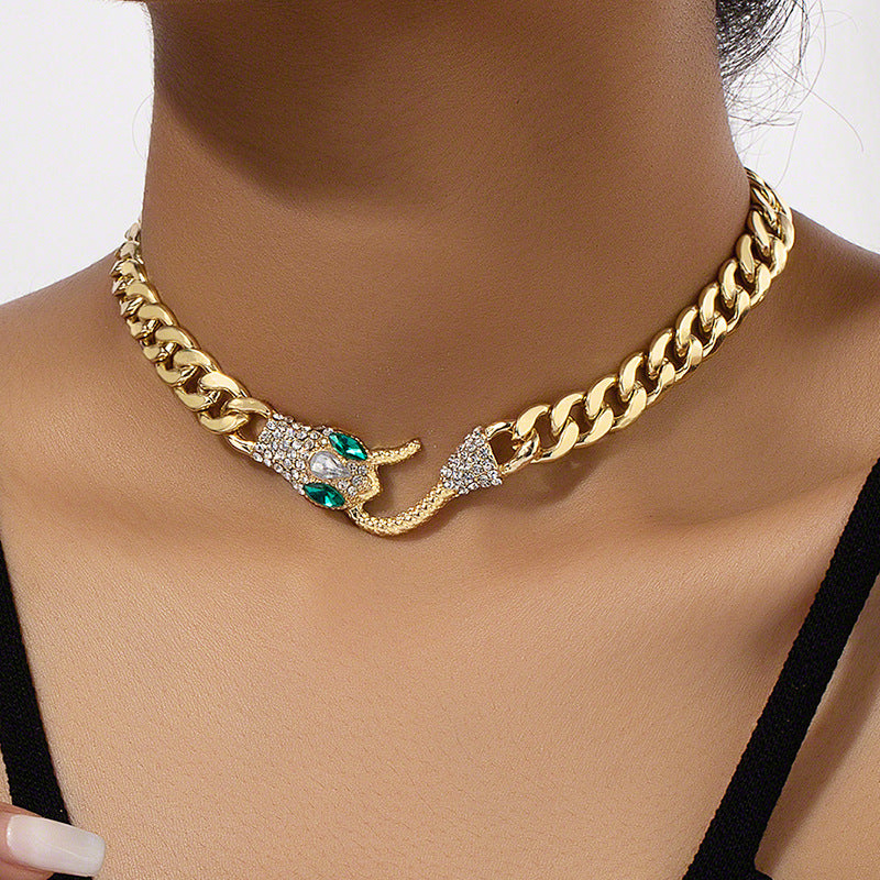 European American metal chain necklace featuring a snake-shaped pendant