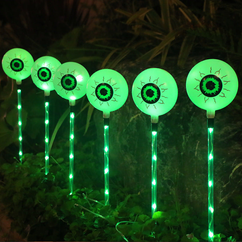 "Spooky LED Solar Halloween Eyeball Ground Lamp for outdoor courtyard decoration – energy-efficient, solar-powered lighting for Halloween yard decor in the US."