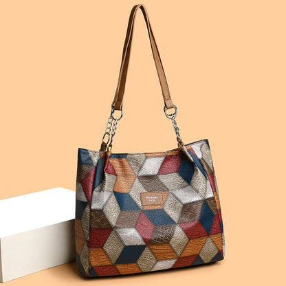 Retro geometric pattern color-matching shoulder bag with large capacity, stylish stitching design for women. Fashionable tote handbag in vibrant colors, perfect for everyday use.