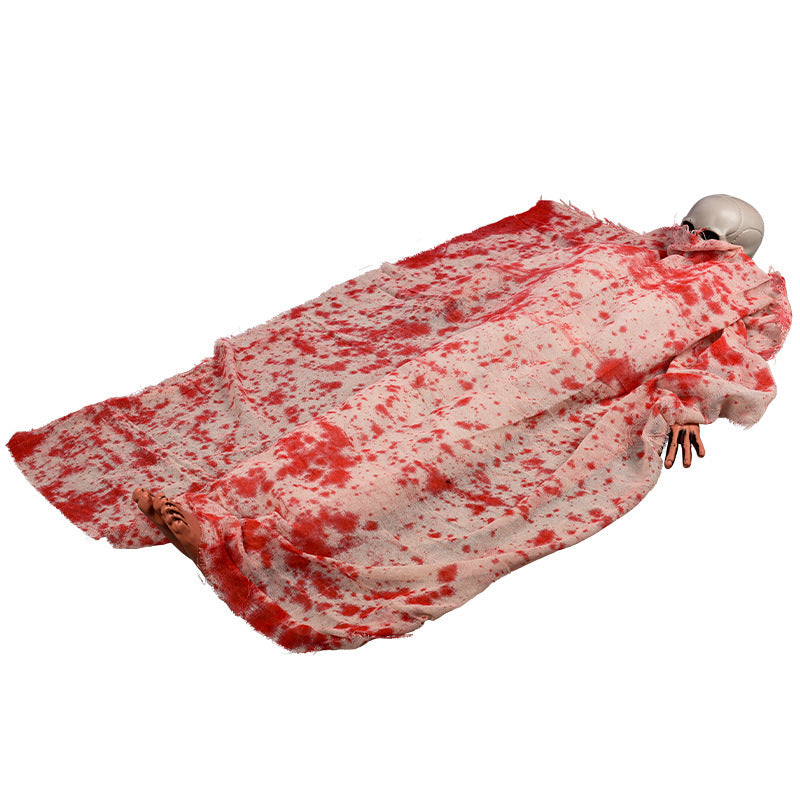 Voice-activated Halloween corpse prop with glowing hair and blood cloth for spooky decoration