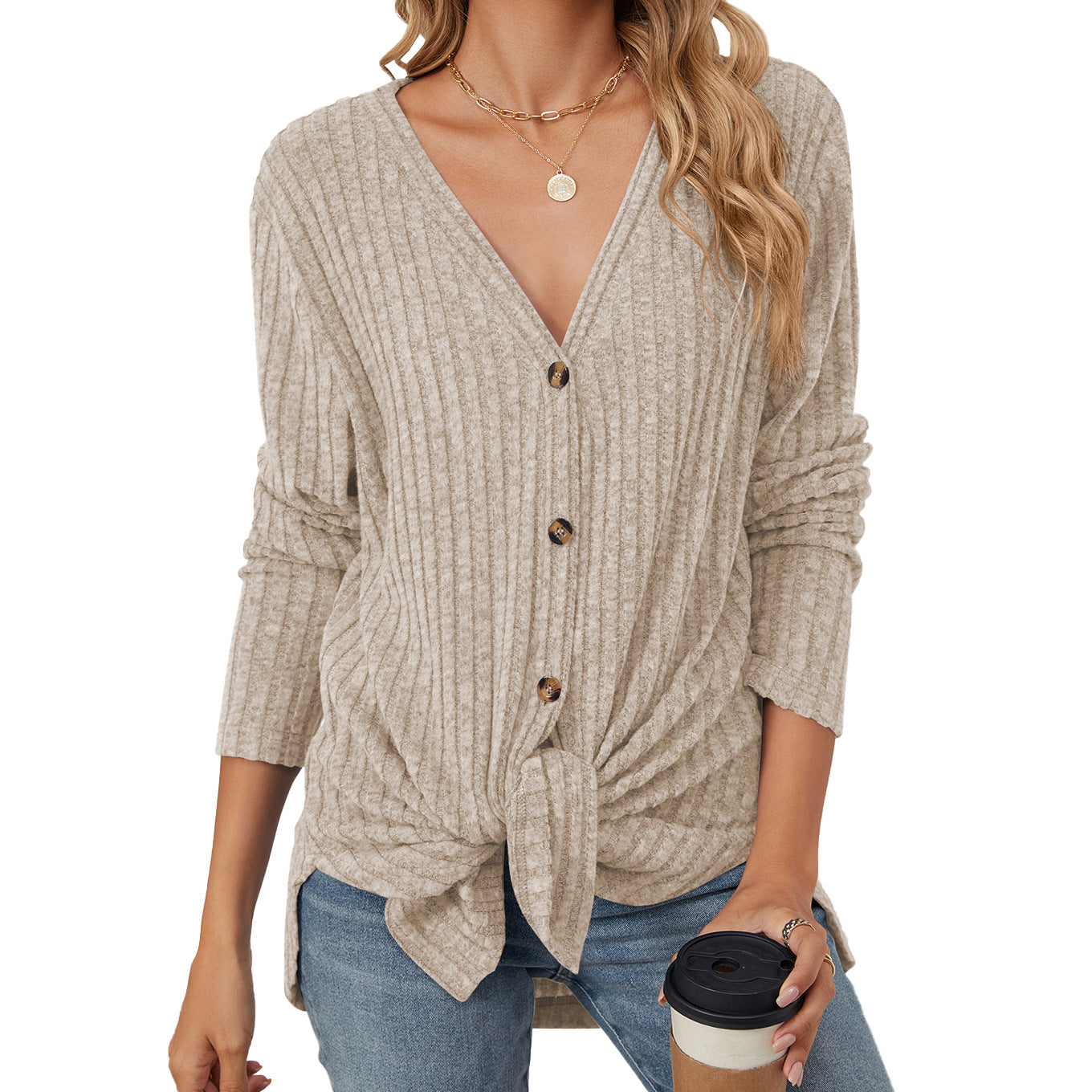 Women's solid color knitted cardigan with long sleeves and button closure. Emerized coat for a cozy and stylish look."