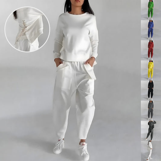 Solid color fashion sweatshirt with long sleeves, back slit, and pockets paired with loose trousers. Women's casual outfit set."