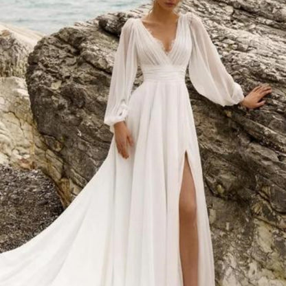 High Waist Plus Size Wedding Dress with Deep V-Neck, Long Sleeves, Backless Design, and High Slit for a sophisticated bridal look.