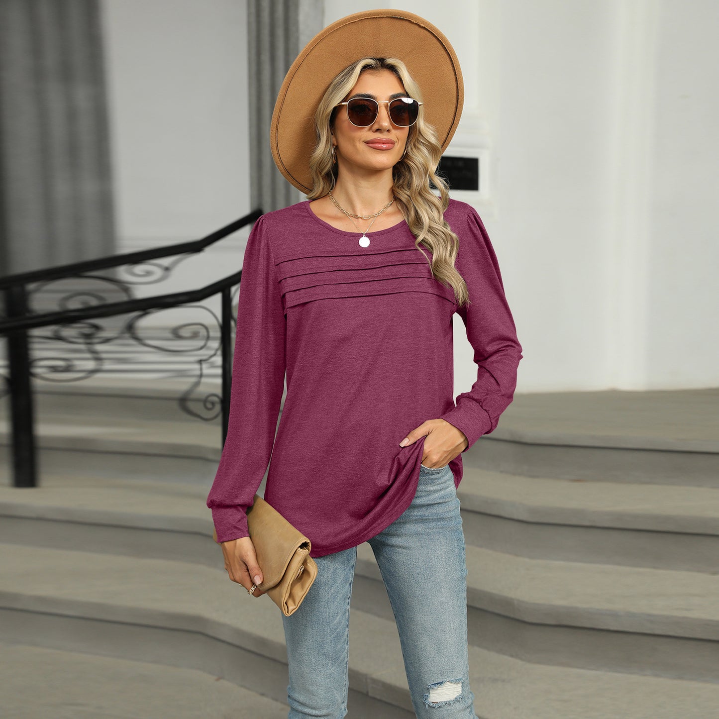 Women's solid color U-neck long-sleeve T-shirt with pleated design. Casual and stylish top for everyday wear.