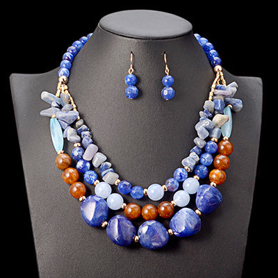 Handmade African beads jewelry set for weddings, including a traditional necklace and matching earrings, perfect for bridal accessories and cultural ceremonies."