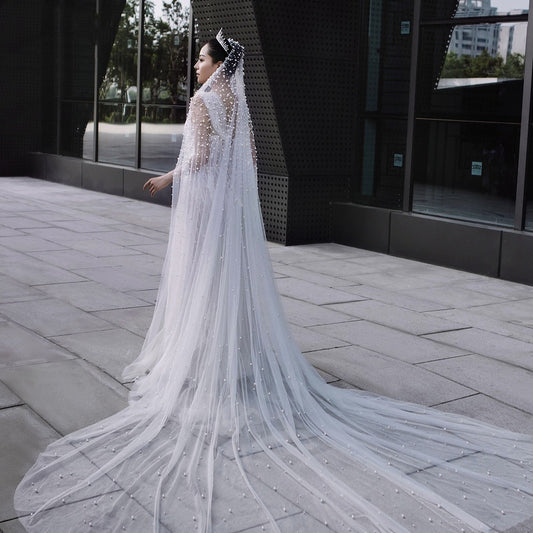 Luxury Heavy Wedding Dress with a Bridal Pearl Veil, offering an elegant and sophisticated look perfect for her special day.