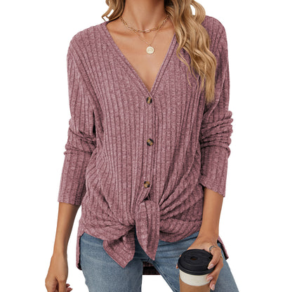 Women's solid color knitted cardigan with long sleeves and button closure. Emerized coat for a cozy and stylish look."